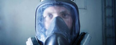 Man with asbestos abatement mask on