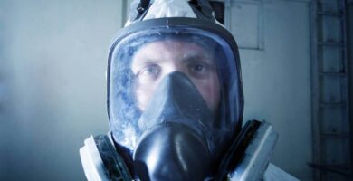 Man with asbestos abatement mask on