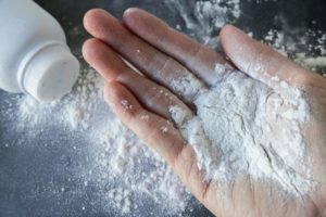 An open hand dusted with talcum powder