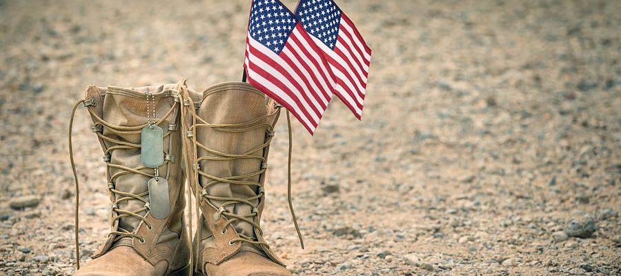 Military boots with two American flags inside