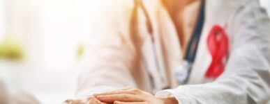 doctor holding a patients hand