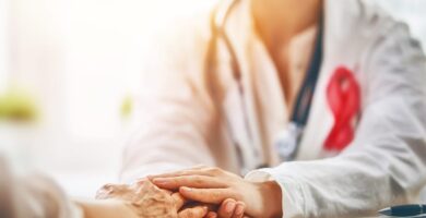 doctor holding a patients hand