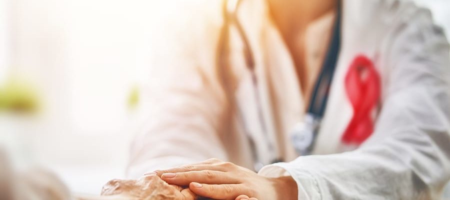 doctor holding a patients hand