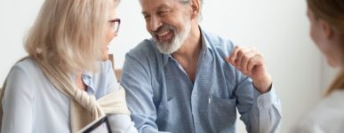 Older couple smiling at each other