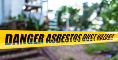 Yellow tape saying danger asbestos dust hazard