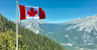 Canadian flag overlooking mountains