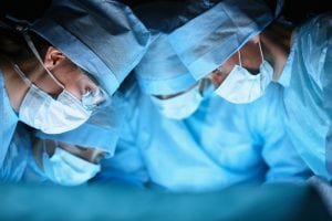 A group of doctors perform peritoneal mesothelioma surgery