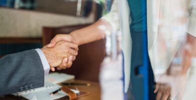 A man and woman shaking hands