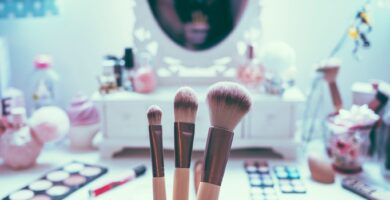 Makeup brushed in front of makeup counter