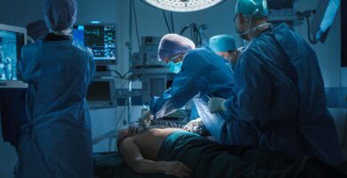 Doctors administer treatment to a sick patient.