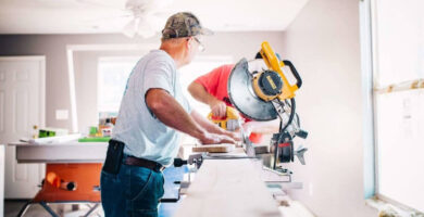 Man cutting wood with a saw