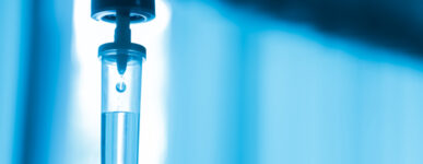 An IV filled with blue liquid