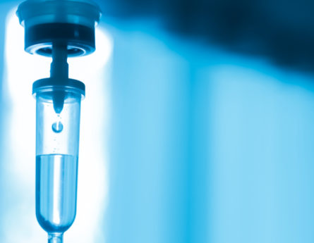 An IV filled with blue liquid