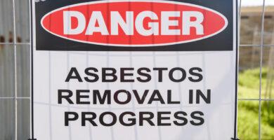 a sign warns about asbestos removal