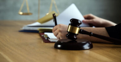 a gavel and legal documents being signed