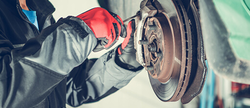 Man working on car brakes