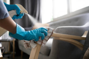 Housekeeping cleaning a couch