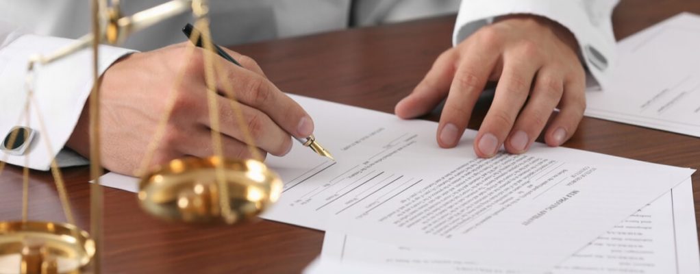 lawyer signing documents