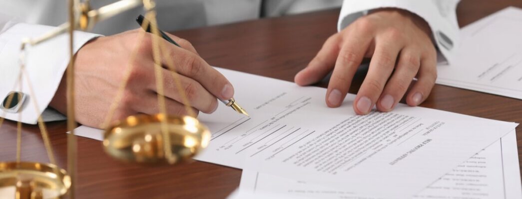 lawyer signing documents