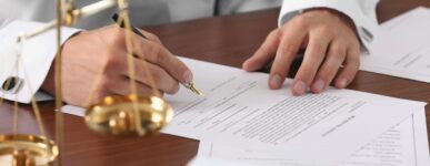 lawyer signing documents