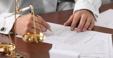 lawyer signing documents