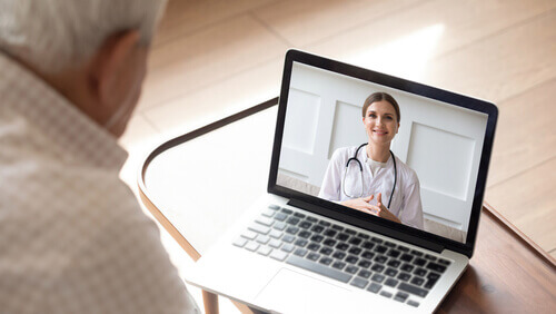 Elderly patient on a video call with a doctor