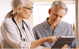 A doctor goes over mesothelioma treatment options with a patient