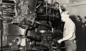 Man repairing machinery on a U.S. Navy ship
