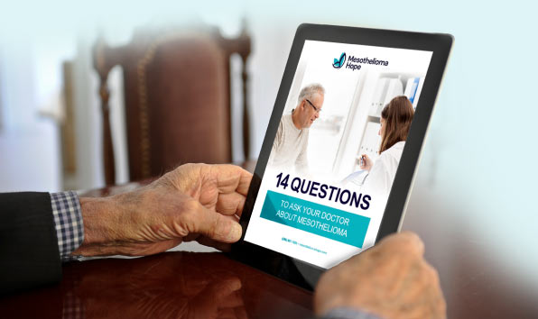 Man reading 14 Questions to Ask Your Doctor on his tablet