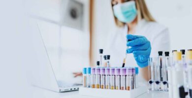 Doctor conducting cancer research in a lab.