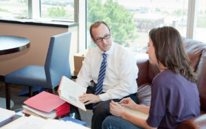 A client meets with an attorney from a mesothelioma law firm 