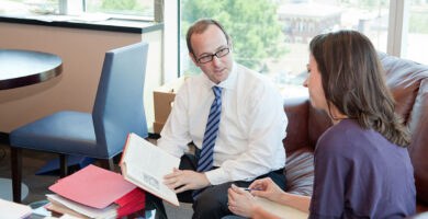 Nick Angelides talking to a client