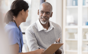A doctor speaks with a patient about mesothelioma stages