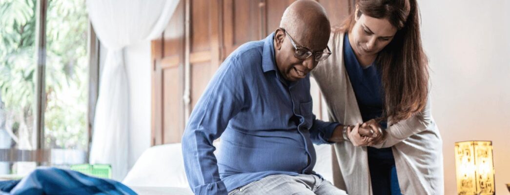 Nurse helping elderly patient
