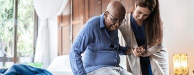 Nurse helping elderly patient