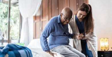 Nurse helping elderly patient