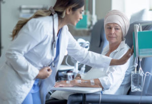 Doctor adjusting chemotherapy dosage