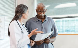 A doctor talks with her patient about mesothelioma treatment options
