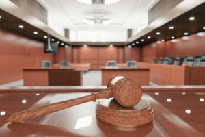 A gavel shown in an empty court room