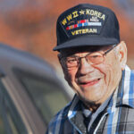 A World War II and Korean War veteran smiling