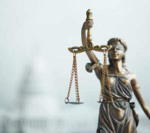 Statue of Lady Justice blindfolded and holding a balance
