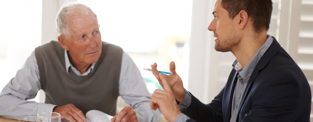 Two men talking at a table