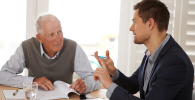 Two men talking at a table