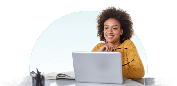 Woman sitting at a desk with a laptop in front of her