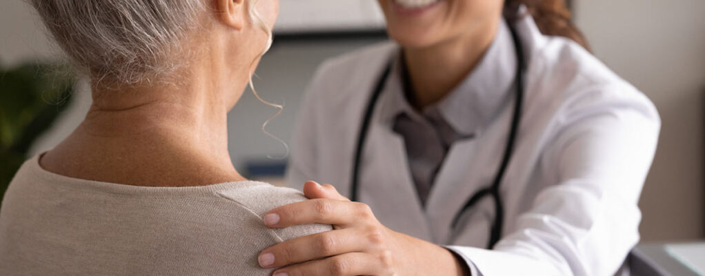 Woman talking with doctor