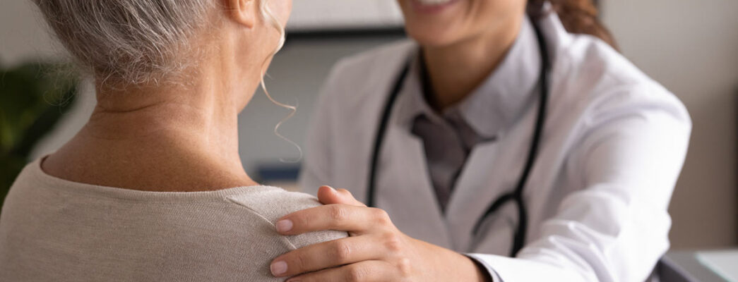 Woman talking with doctor