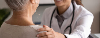 Woman talking with doctor