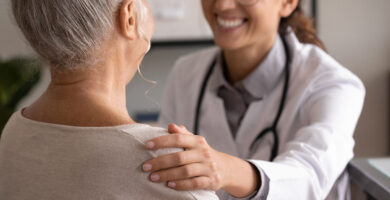 Woman talking with doctor