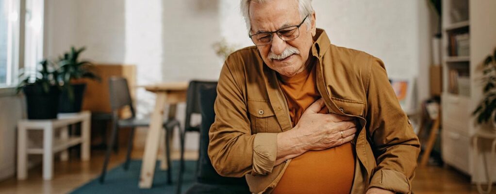 Man clutches chest in pain