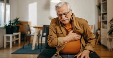 Man clutches chest in pain